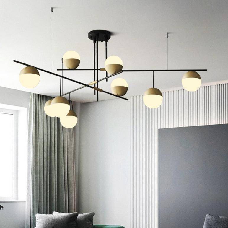 Lustre design avec branches et boules en verre et métal doré